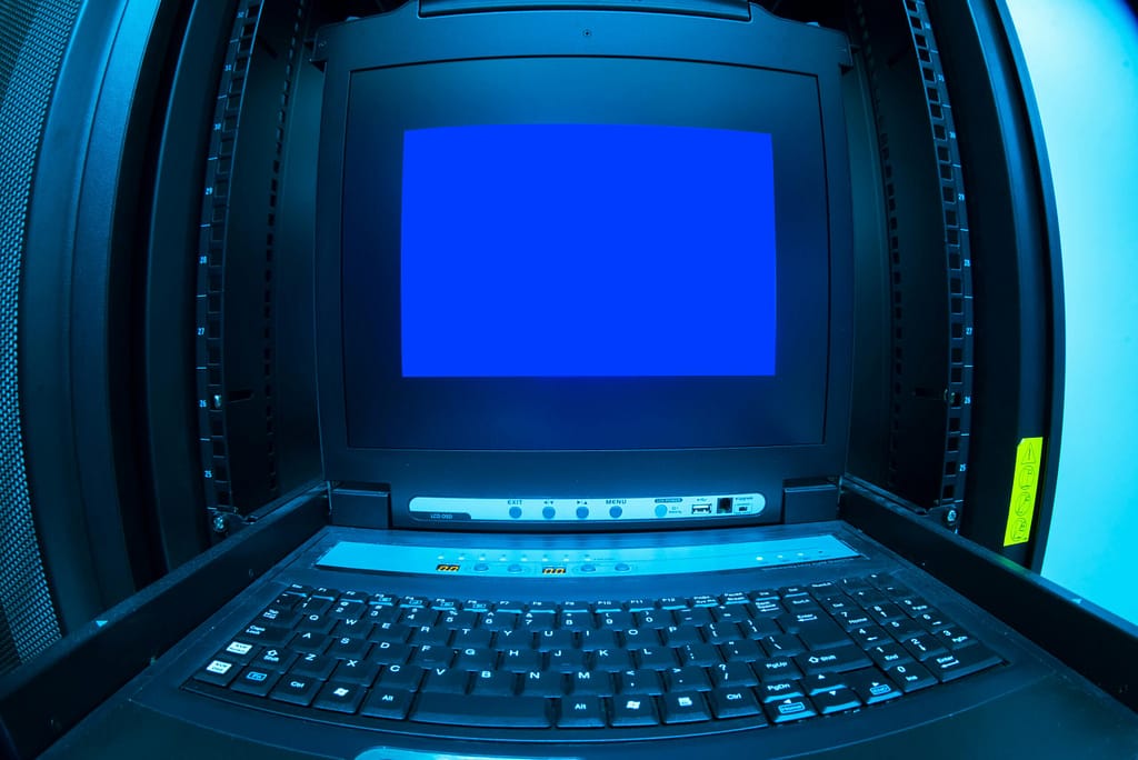 Is Cloud Storage Safe for Personal Data? Close-up of a blue screen error shown on a data center control terminal.